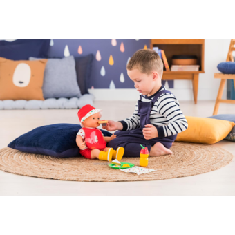 Un porte-bébé avec sa poupée de la marque Corolle. - Label Emmaüs